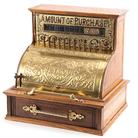 An extremely rare antique "The Seymour" cast iron & quarter sawn oak Cash Register, circa 1890s, man