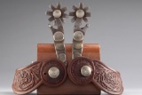 Pair of double mounted Iron Spurs with Mexican Pesos and silver sombreros on heel bands with flipper