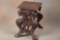 Highly carved wooden JardiniÃ¨re Stand with carved winged lions on each end and full carved top. Top