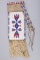 This lot consists of the following two Items: (1) A Hide and Beaded, fringed Pipe Bag, 23