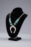 Navajo Style Squash Blossom with turquoise and silver beads.