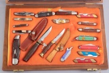 Wooden and glass Showcase displaying a collection of 18 Knives, with mixed makers. WILL BE SOLD AS O