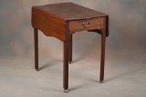 Early Pembroke walnut Drop Leaf Table with drawered skirt, circa 1790, with leather rollers. This fi
