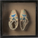 Framed pair of leather Moccasins believed to be doeskin. Showing use but appear to be in good condit