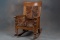 Beautiful antique oversize quarter sawn oak Rocker, professionally upholstered in brindle hide with