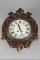 Antique Black Forrest oval shaped Wall Clock with marble dial and porcelain numbers, both time and s