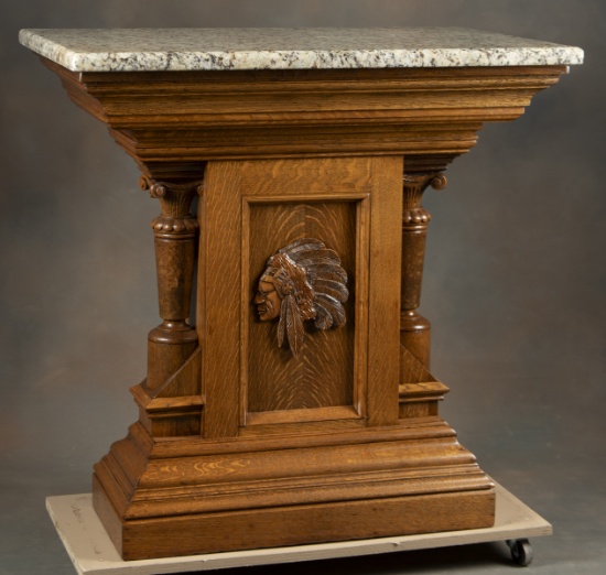 Antique oak Pedestal with polished granite top, measures 36 1/2" T x 37 1/4" W x 23" D. Embossed Ind