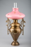 Fine antique Victorian Parlor Lamp, circa 1880s, in rich brass patina and the original pink cased gl