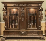 Fantastic and monumental antique mahogany double door Gun Cabinet, elaborately carved with 50