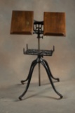 Antique cast iron and wooden Book Stand with revolving base, circa 1900-1910, manufactured by 