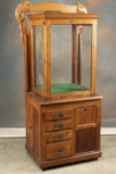 Unique antique oak multi-drawered Doctor's Cabinet with revolving glass showcase top, manufactured b