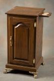 Custom oak Slot Machine Stand with blind door front, brass hardware with four ornate brass claw feet