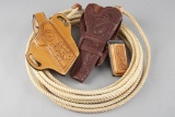 This lot consists of four Items to include: (1) A 24 ft. Lariat Rope. (2) A tooled double loop Holst