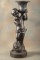 Antique Cast Iron Garden Planter, with near life size garden boy carrying large urn on his shoulder.