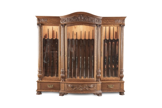 Fine R.J. Horner marked, highly carved quarter sawn oak, three door Gun Cabinet, circa 1900, in orig
