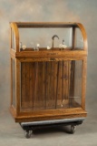 Fine Antique oak curved glass Cane Cabinet, floor model, circa 1890-1900 with brass label marked 