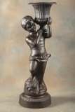 Antique Cast Iron Garden Planter, with near life size garden boy carrying large urn on his shoulder.
