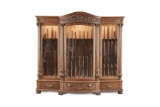 Fine R.J. Horner marked, highly carved quarter sawn oak, three door Gun Cabinet, circa 1900, in orig