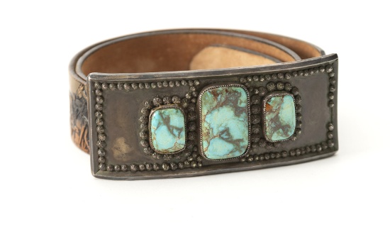 Turquoise and silver oblong Buckle, 6" L x 4 1/4" T, accompanied by a western tooled Belt with wagon