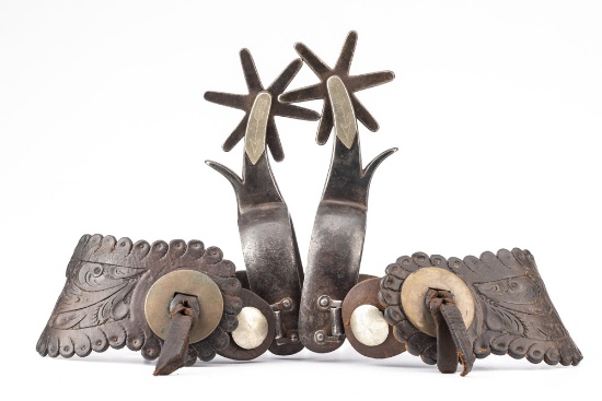 Pair of "Kelly Bros." marked single mounted Spurs in the famous Bronc Buster pattern, 1 1/8" heel ba
