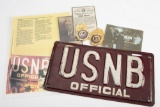 Rare, vintage License Plate marked in raised letters â€œU S N B/ OFFICIALâ€. Plate is dark maroon i