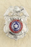 Silver tone Eagle Crest Shield Badge, measures 2 Â¼â€ T x 1 Â¾â€ W, marked â€œPATROLMAN / POLICE /