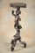 Antique figural carved mahogany Pedestal with full carved cherub supporting top. Very unique 13