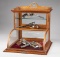 Very unique oak, curved glass, table top model Showcase with bronze label on front marked 