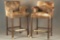 Matched pair of high seat Game Chairs with arms, covered with brindle cow hide and spotted border, 4