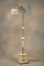 Outstanding antique onyx and brass Parrot Floor Lamp, circa 1920s, on footed base with original 7 1/