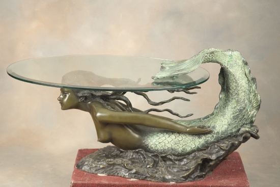 Very unusual large Bronze Mermaid Coffee Table with oval beveled glass top. Bronze Mermaid measures