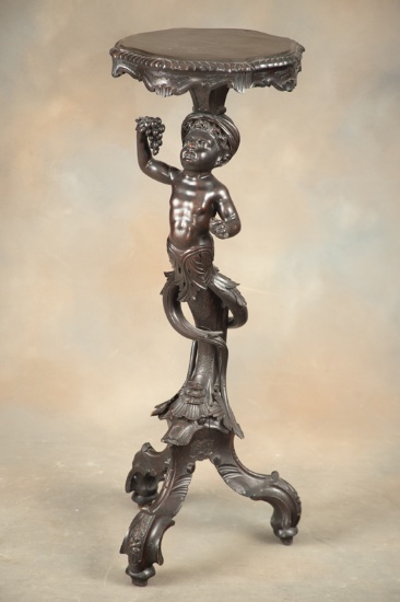 Antique figural carved mahogany Pedestal with full carved cherub supporting top. Very unique 13" dia