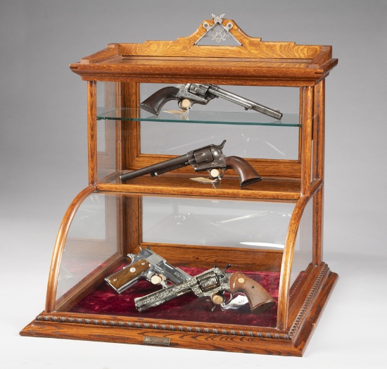 Very unique oak, curved glass, table top model Showcase with bronze label on front marked "J.W. Winc