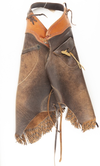 Pair of custom Bull Hide Fringed Chinks with outside sewn pockets, showing use but in very good cond
