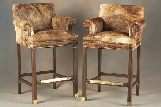 Matched pair of high seat Game Chairs with arms, covered with brindle cow hide and spotted border, 4