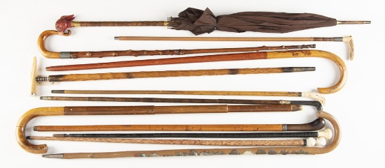 Collection of 12 Walking Sticks, Canes and two Umbrellas, one umbrella is concealed, in various shap