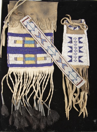 This lot consists of three items to include: (1) Beaded Flint Bag with fringe and tin tassels. (2) A