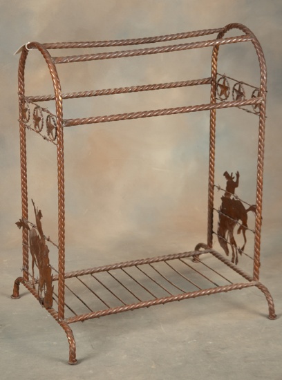 Fine custom iron Saddle Stand with silhouettes of cowboys on bucking horses on each end and a row of