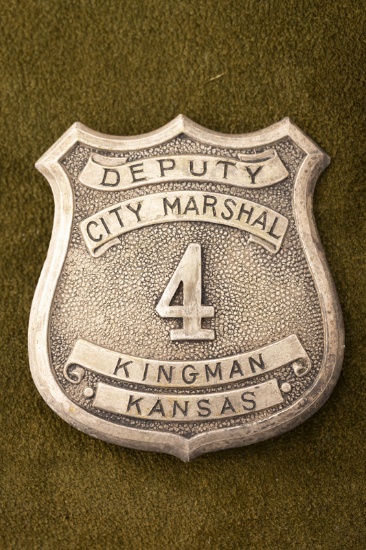 Vintage silver tone Shield Badge marked â€œDEPUTY/CITY MARSHAL/ 4 /KINGMAN/ KANSASâ€, has lots of a