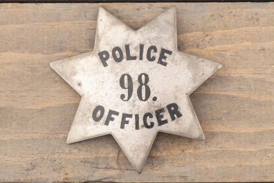 Large vintage 7-point Star Badge marked â€œPOLICE 98 OFFICERâ€, possibly sterling silver with black