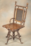 Scarce antique Hunzinger walnut revolving high back Piano Stool, circa 1890, with wooden ball and cl