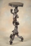 Antique figural carved mahogany Pedestal with full carved cherub supporting top. Very unique 13