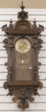 Beautiful antique carved walnut Calendar Wall Clock with eight day time and strike, circa 1890s, bel