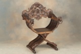 One of a near matching pair of heavily carved antique Fire Side Chairs, circa 1880s-90s, with massiv