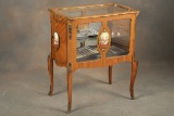 Unique vintage French style, floor model Curio Cabinet made of satin wood with hand painted oval cam