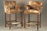 Matched pair of high seat Game Chairs with arms, covered with brindle cow hide and spotted border, 4