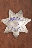 Vintage 7-point Star Badge marked â€œSERGEANT/ 15/ POLICEâ€, two holes at the top of badge, looks l