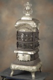 FROM THE MAN ROOM OF C.W. LYLE: A fantastic, ornate cast iron and nickel, wood burning Stove titled