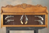 Unusual antique oak, glass front Revolver Display Case, circa 1900. The case is set up to hold six (