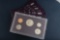 Group of seven (7) uncirculated cased U.S. Proof Sets, totaling 35 Coins. five sets are dated 1985.